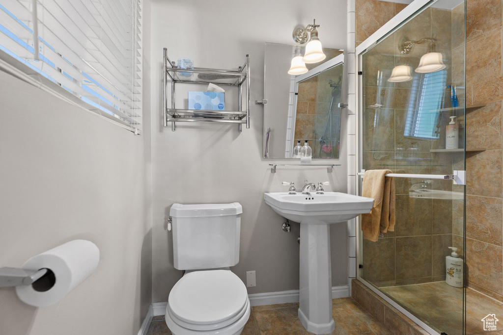 Full bath with healthy amount of natural light and a shower stall