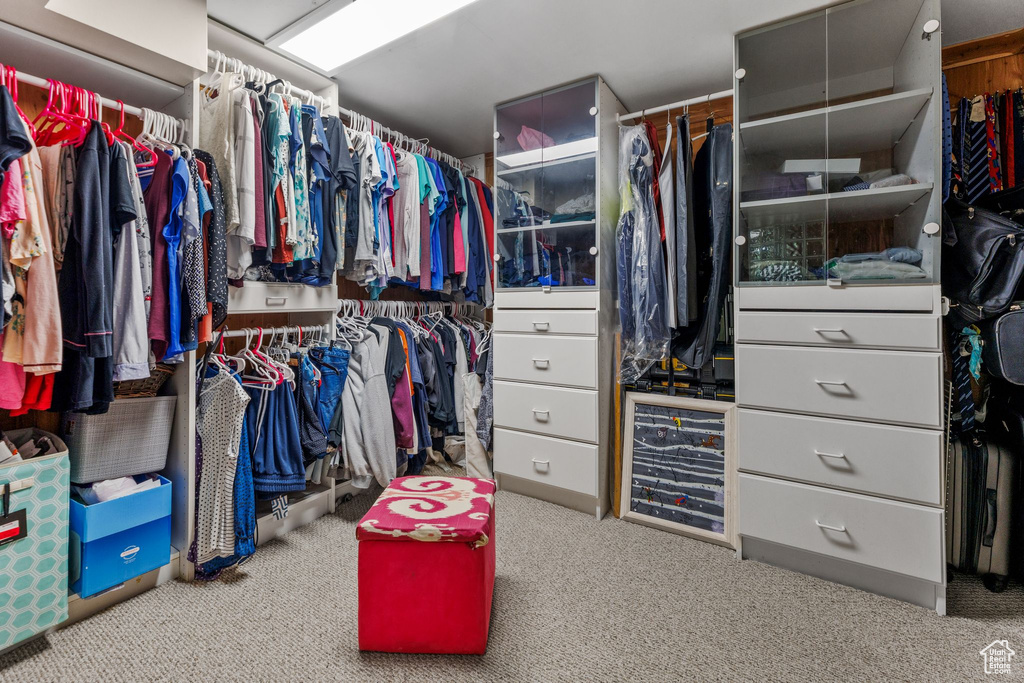 Walk in closet featuring carpet flooring