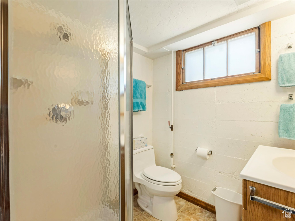 Bathroom with vanity and a shower stall