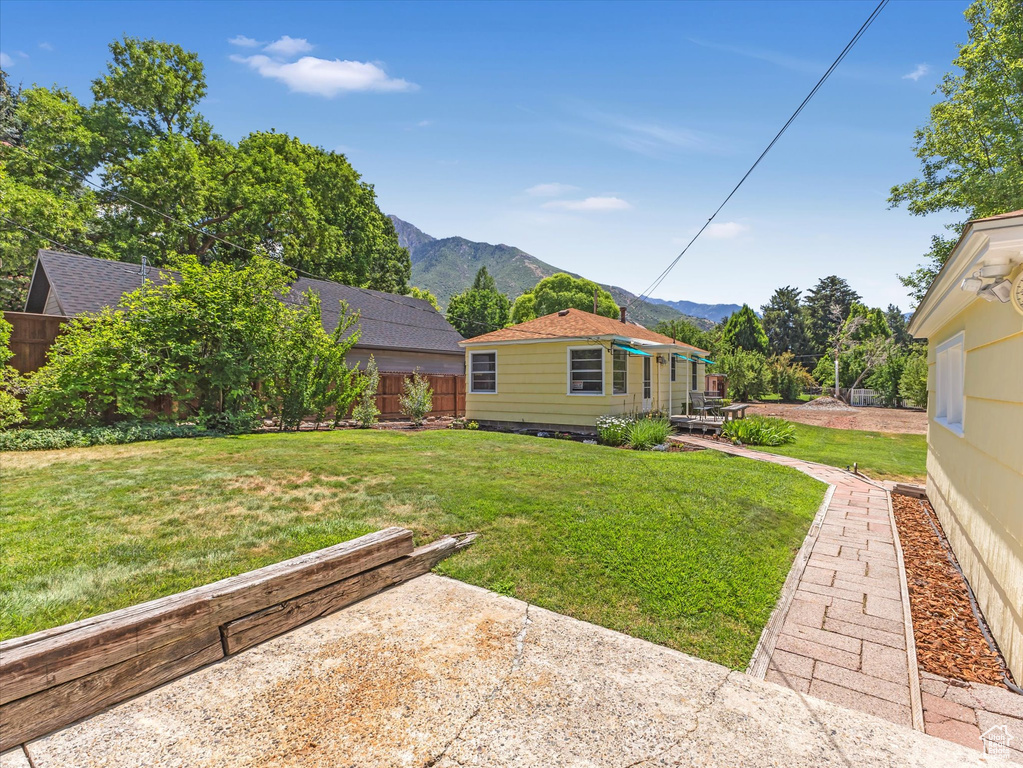 View of yard with a mountain view and a patio