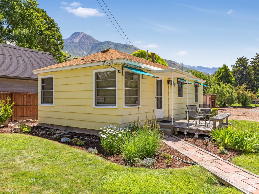View of front facade featuring a deck with mountain view
