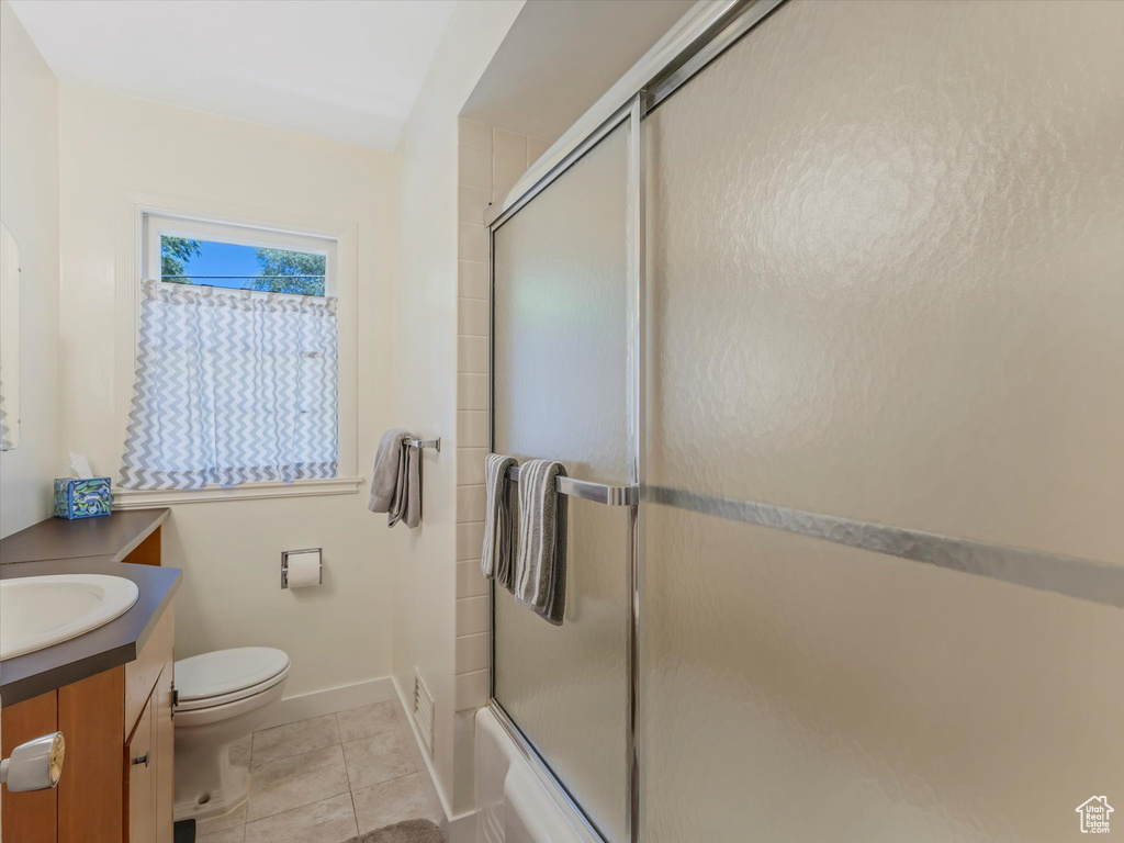Bathroom featuring vanity and tile patterned flooring
