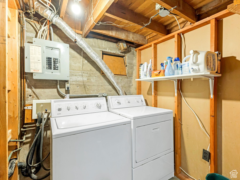 Washroom featuring washer and clothes dryer and electric panel