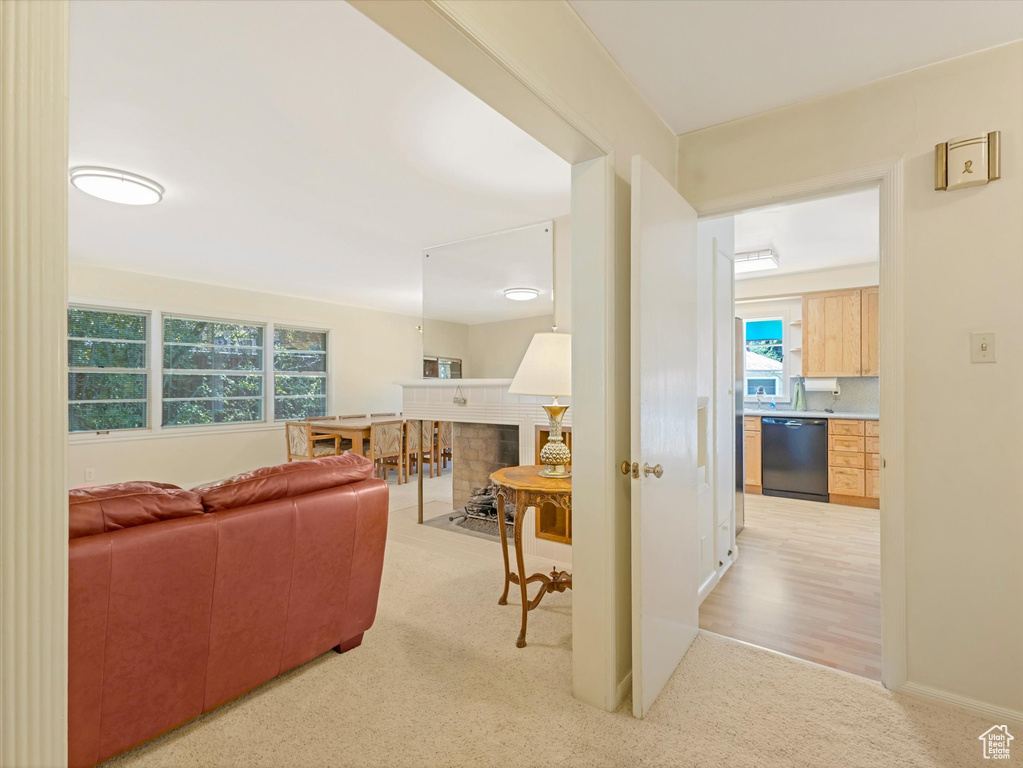 Living area featuring light carpet
