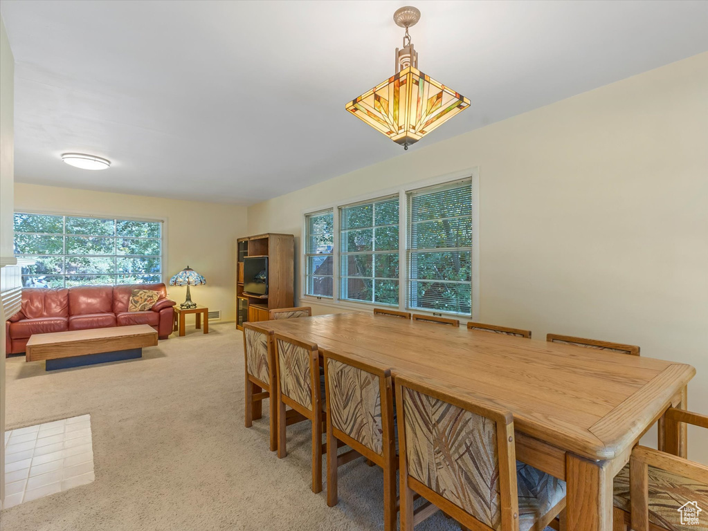 Dining space with light carpet