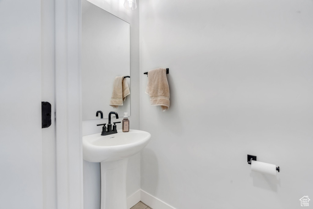 Bathroom with baseboards and a sink