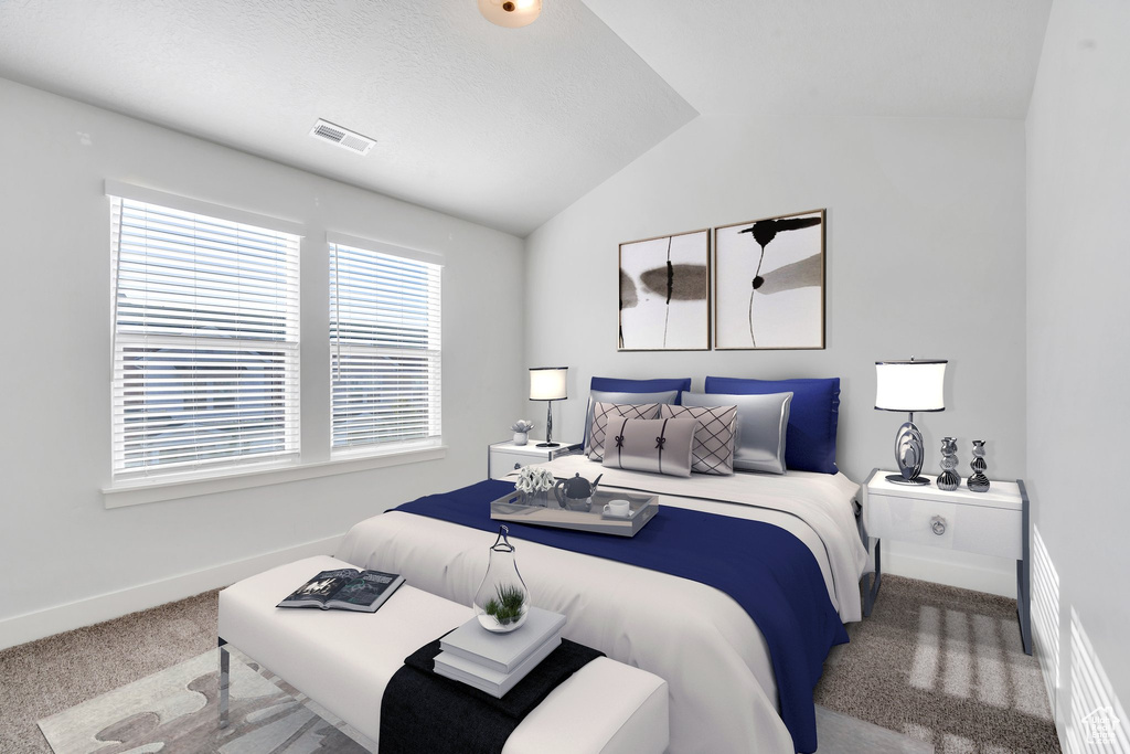 Bedroom with carpet flooring and vaulted ceiling