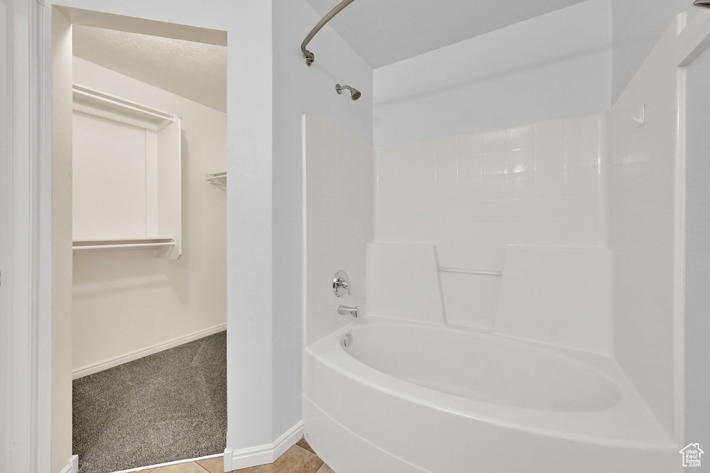 Bathroom with  shower combination and a walk in closet