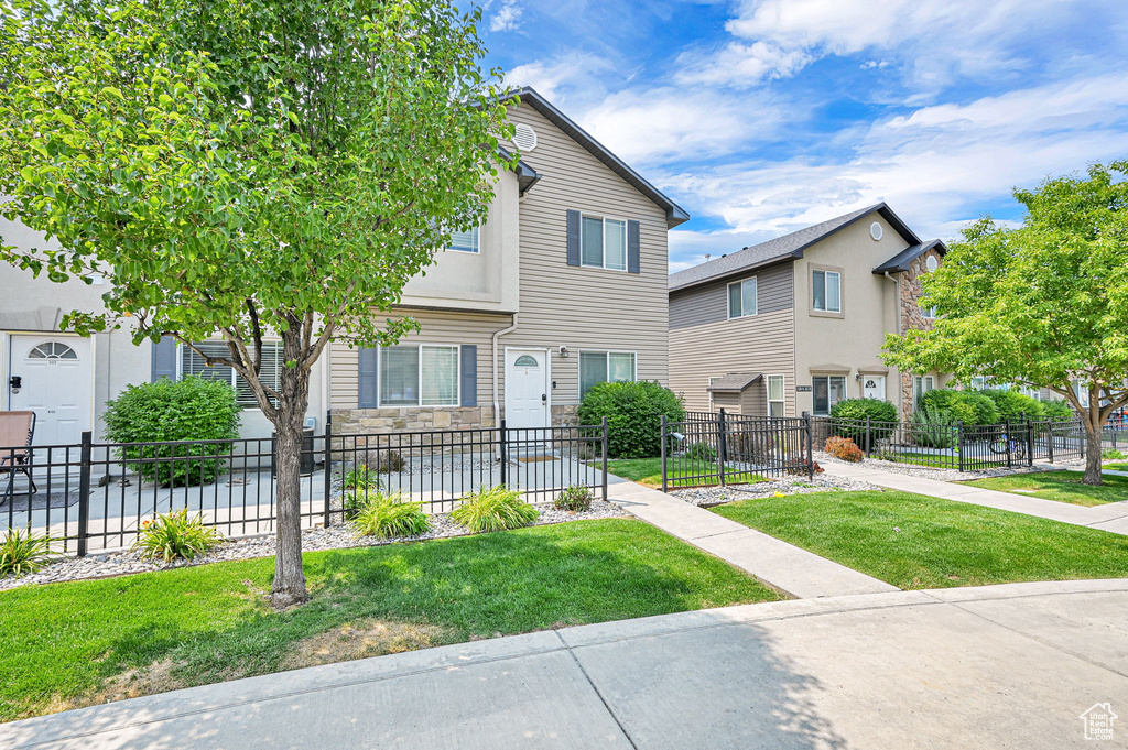 Townhome / multi-family property with stone siding