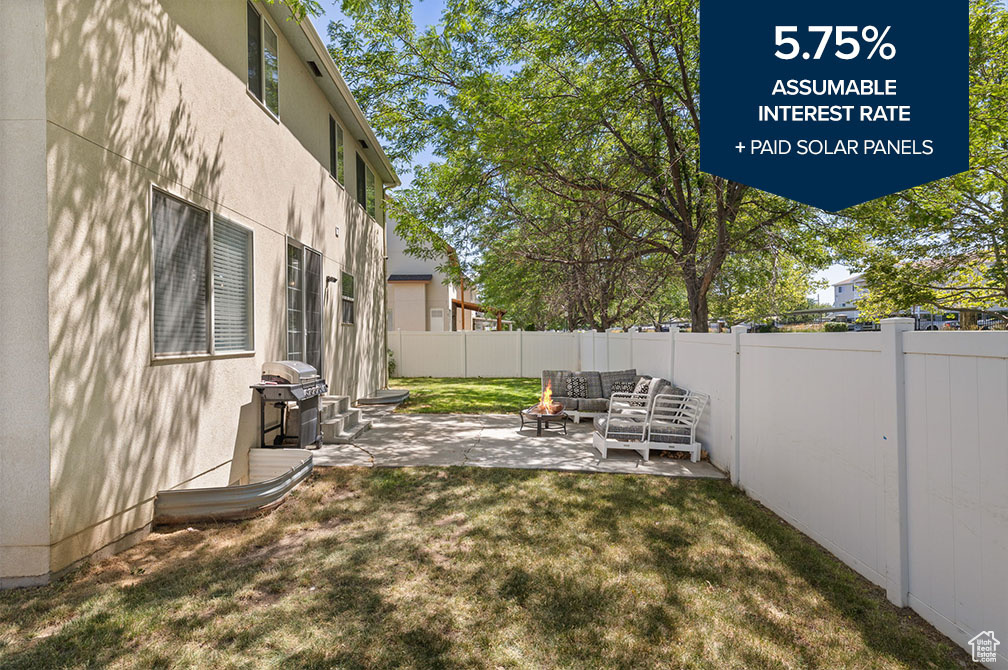 Fenced backyard featuring an outdoor hangout area and a patio area