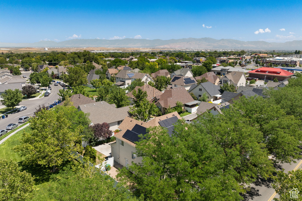 Aerial view of residential area featuring a mountainous background