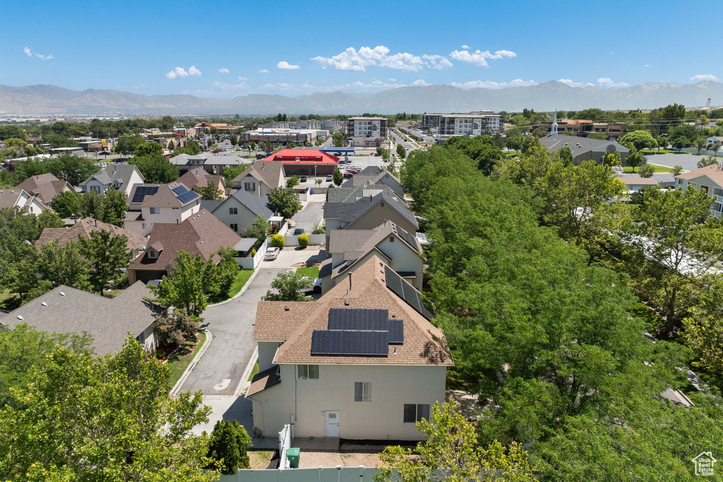 Aerial view of residential area featuring a mountainous background