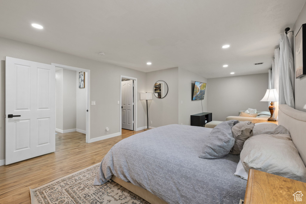 Bedroom with recessed lighting and light wood-type flooring