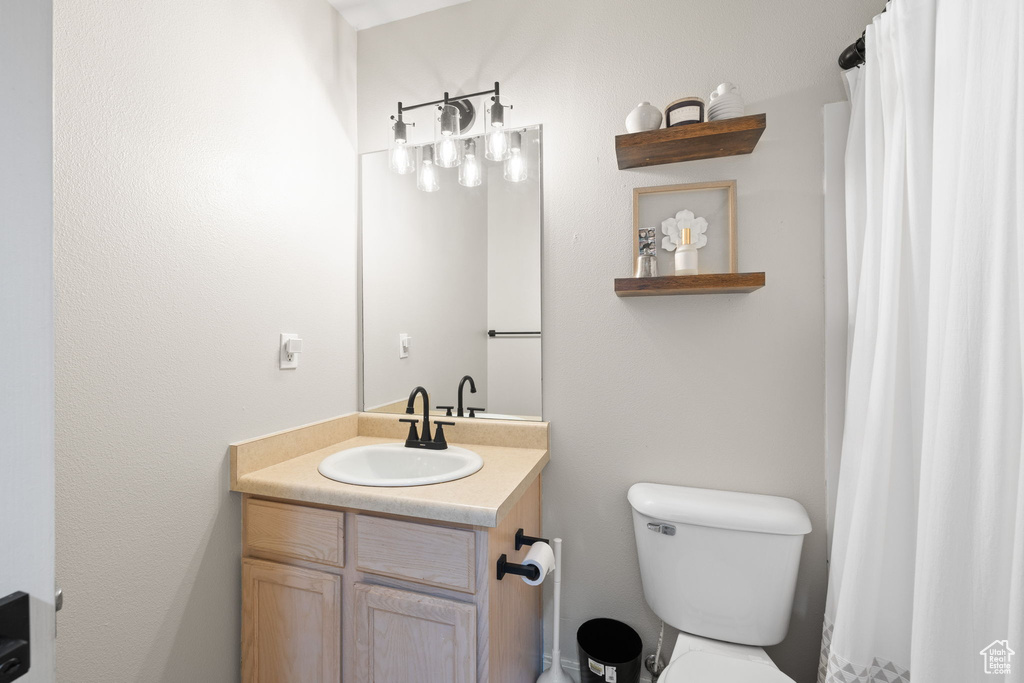 Bathroom with vanity and a shower with shower curtain