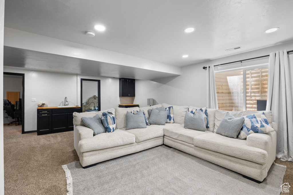 Living room featuring light carpet and recessed lighting