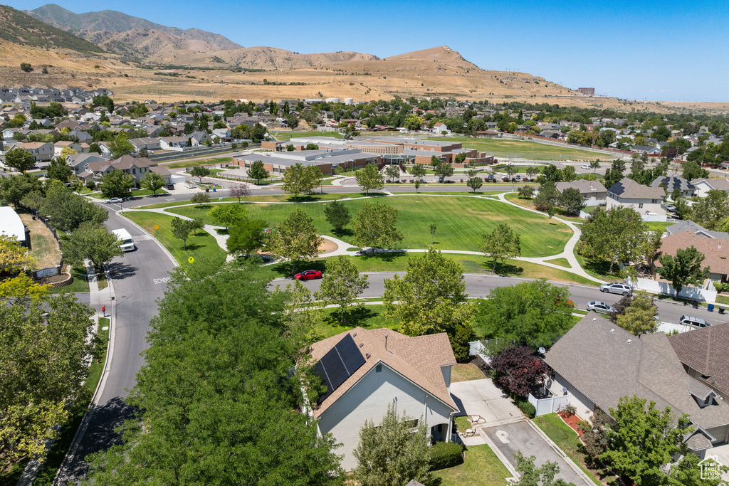 Aerial perspective of suburban area featuring a mountainous background