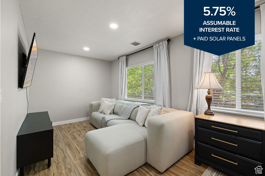 Living room featuring light wood-style floors and recessed lighting