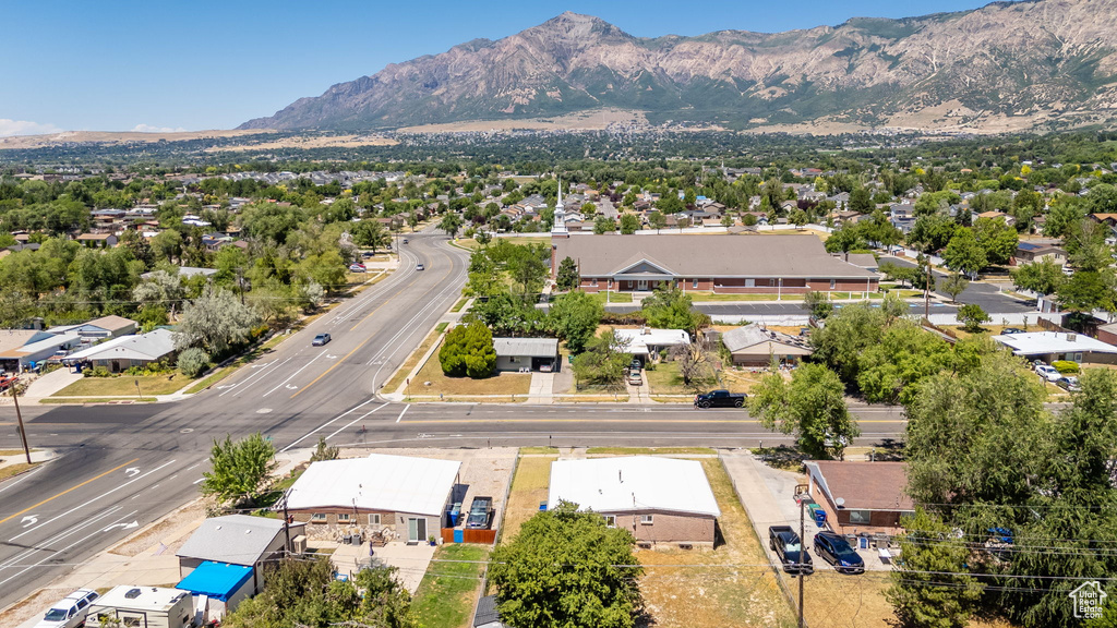 Aerial perspective of suburban area with a mountain backdrop