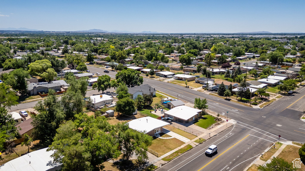 Aerial perspective of suburban area with a mountainous background