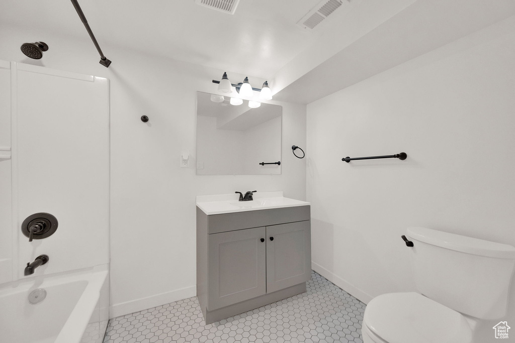 Full bath featuring vanity and shower / washtub combination