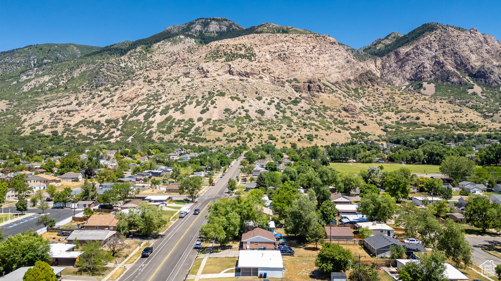 Aerial view of residential area featuring a mountainous background