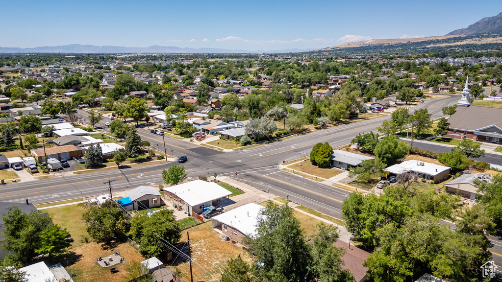 Aerial perspective of suburban area featuring a mountain backdrop