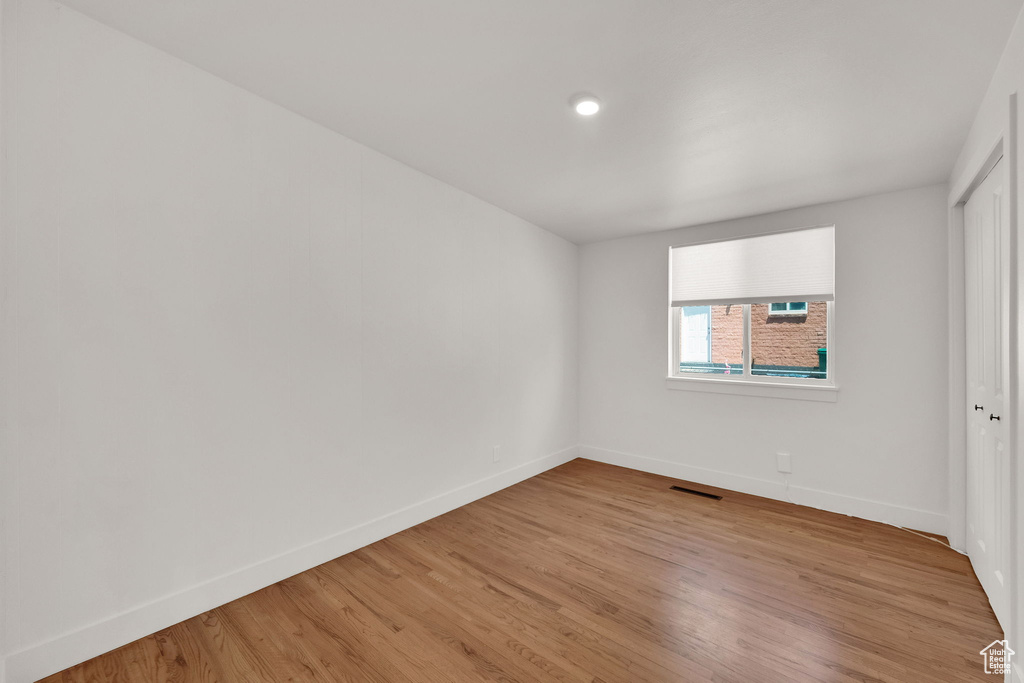 Unfurnished room featuring light wood-type flooring