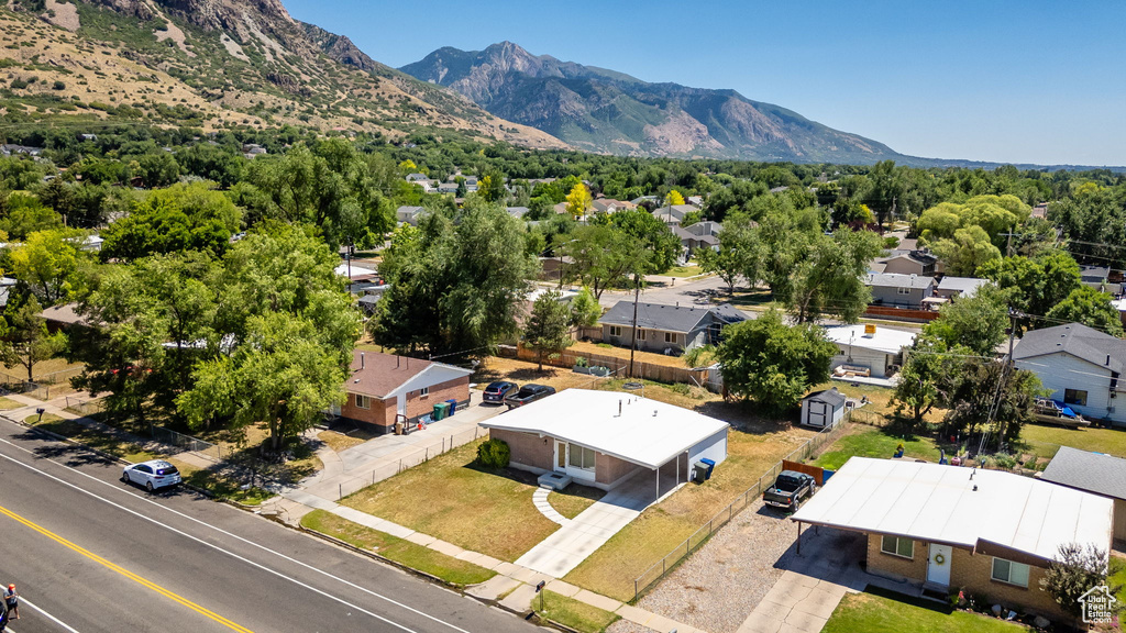 Aerial perspective of suburban area featuring a mountainous background