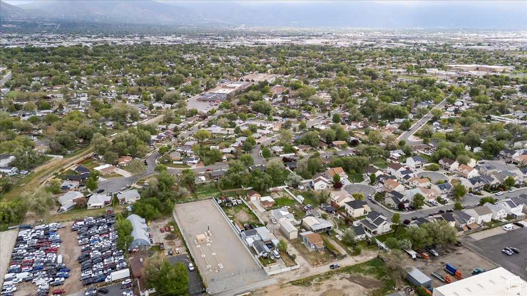 Aerial overview of property's location featuring a mountainous background