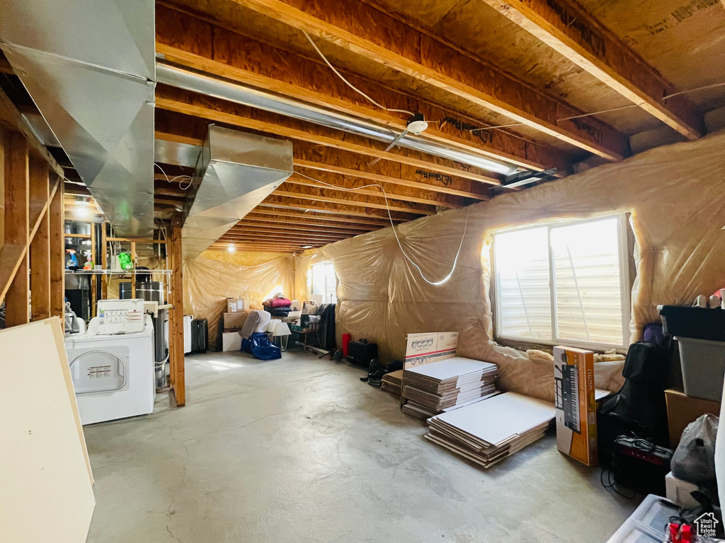 Basement featuring washer / dryer and plenty of natural light