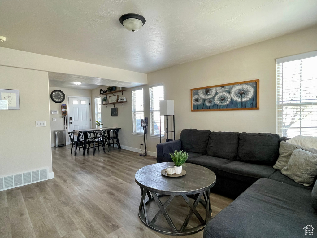 Living area featuring wood finished floors and baseboards