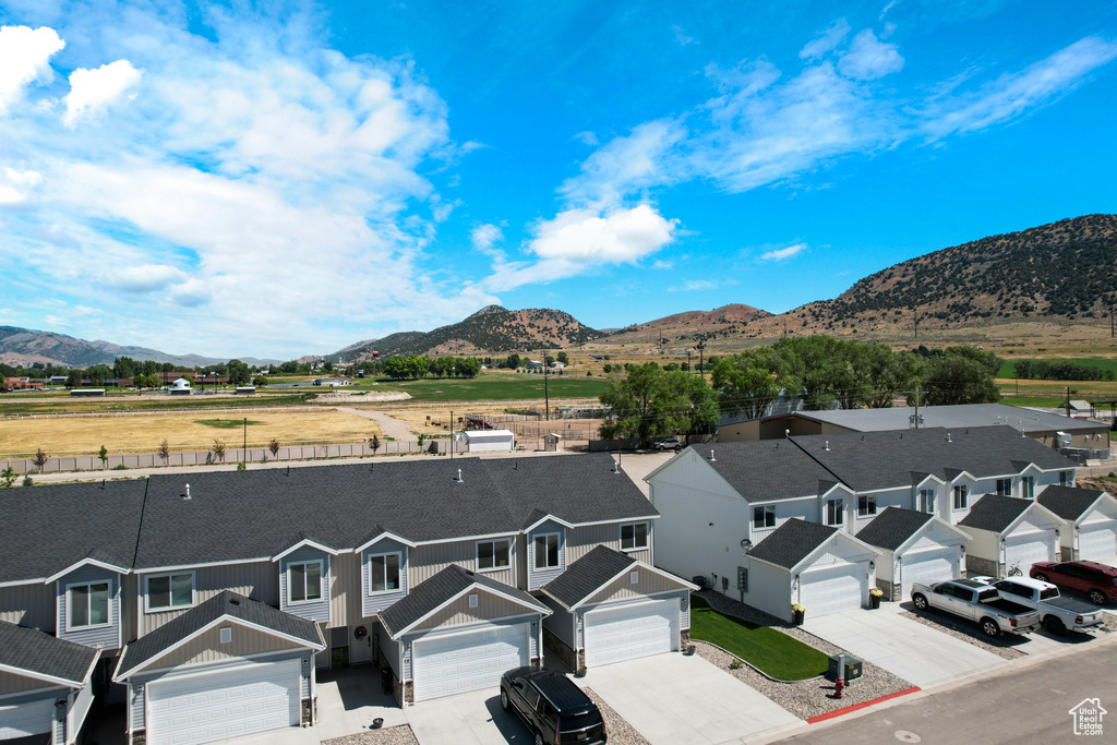 View of mountain backdrop featuring nearby suburban area