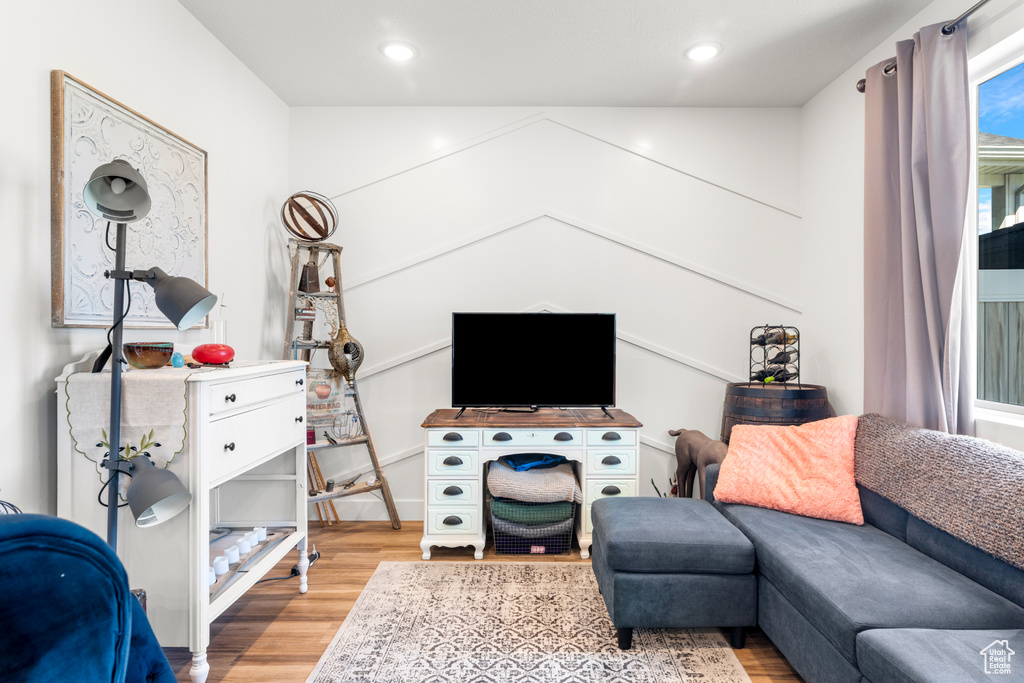 Living area featuring light wood-type flooring and recessed lighting