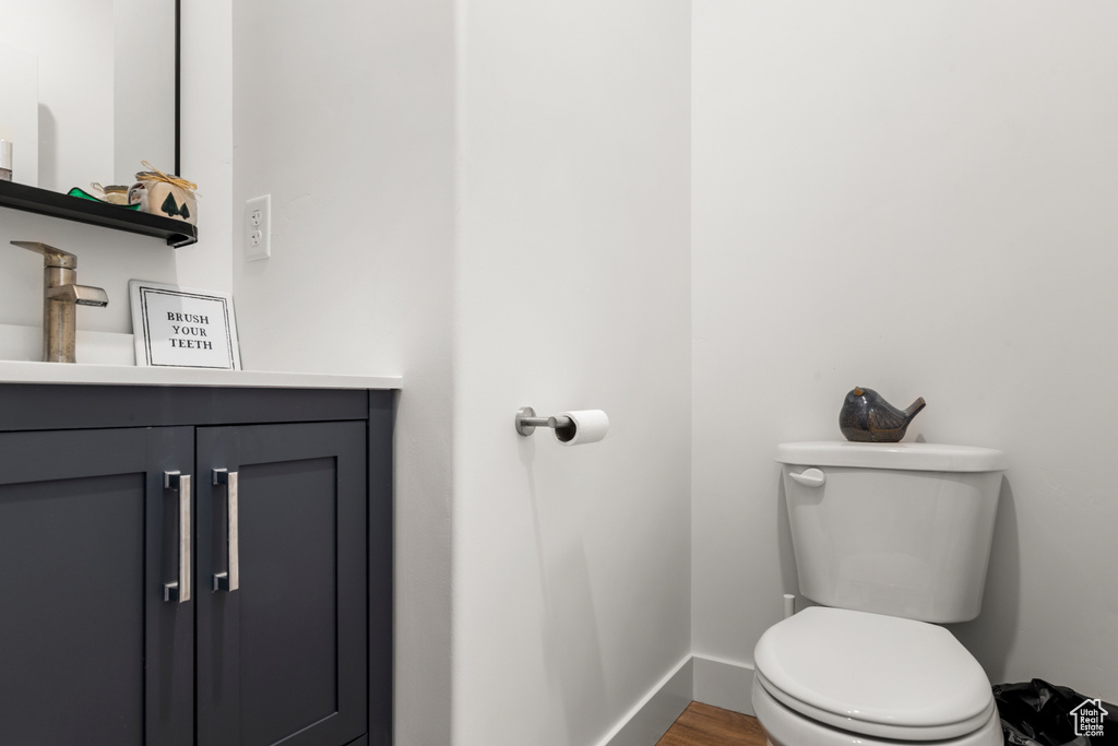Bathroom featuring vanity and wood finished floors