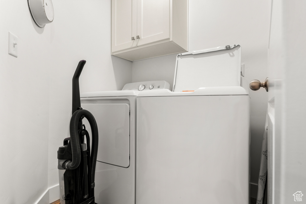 Laundry room with cabinet space and separate washer and dryer