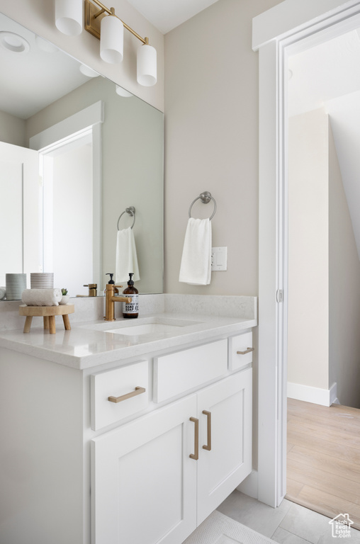 Bathroom featuring vanity and tile patterned floors