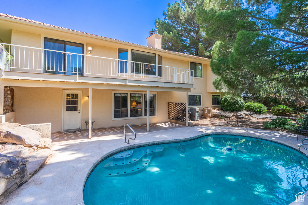 Outdoor pool featuring a patio area