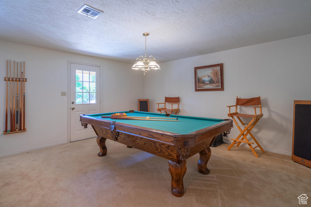 Rec room with carpet, billiards table, a chandelier, and a textured ceiling