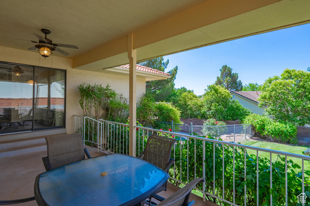 View of patio featuring a ceiling fan and outdoor dining area