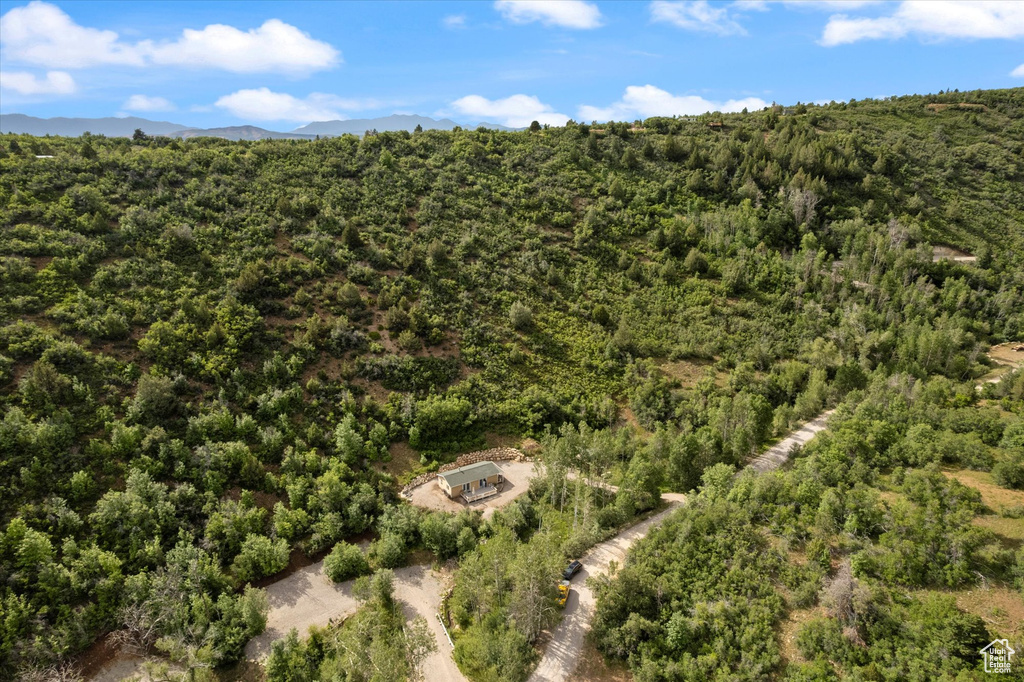 Aerial view of property\\\\\\\\\\\\\\\'s location with a forest and a mountainous background