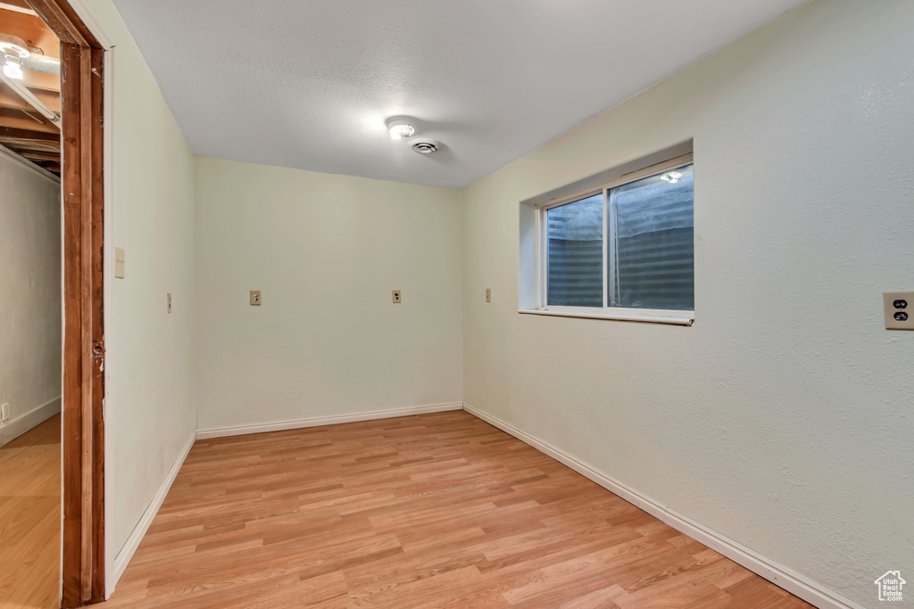 Unfurnished room featuring light wood finished floors