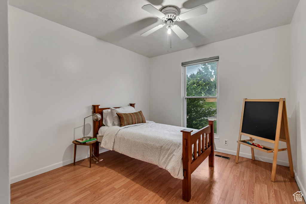 Bedroom featuring light wood finished floors and a ceiling fan