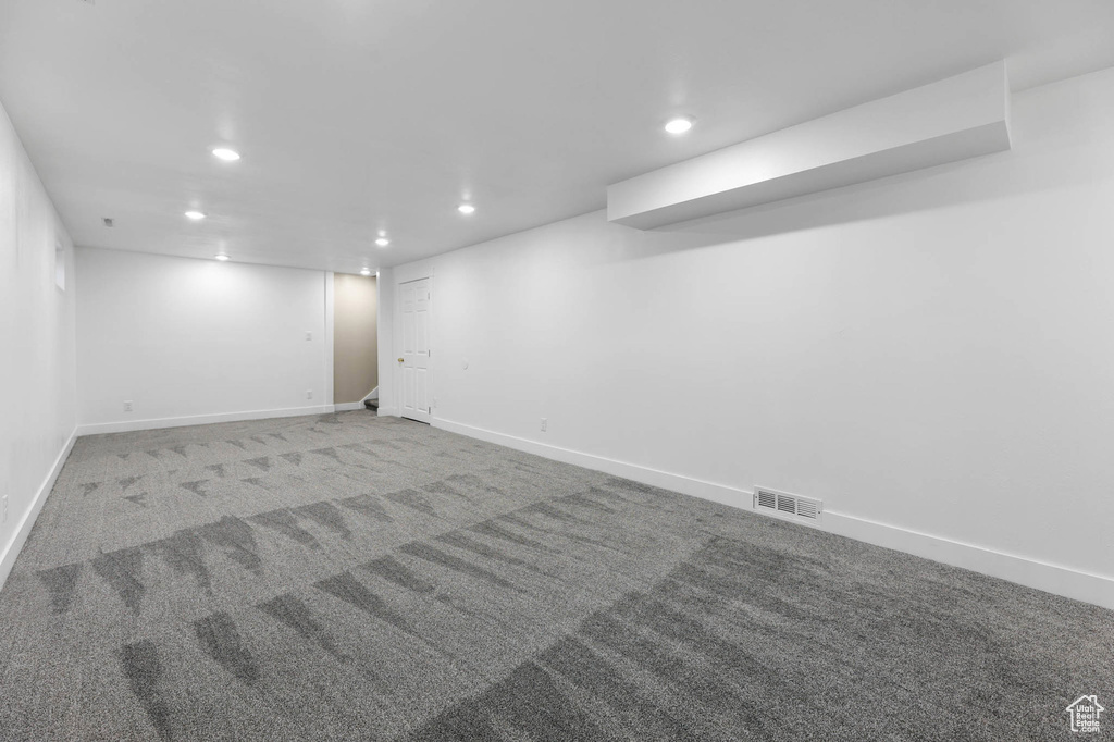 Finished basement with recessed lighting and carpet floors