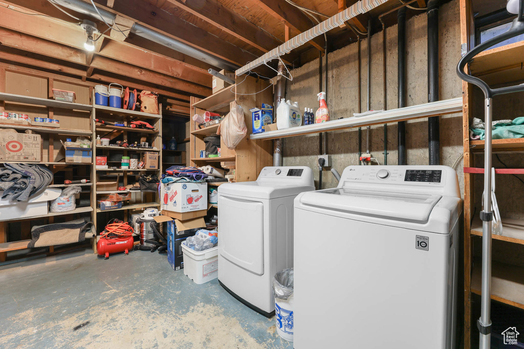 Laundry room with washer and clothes dryer