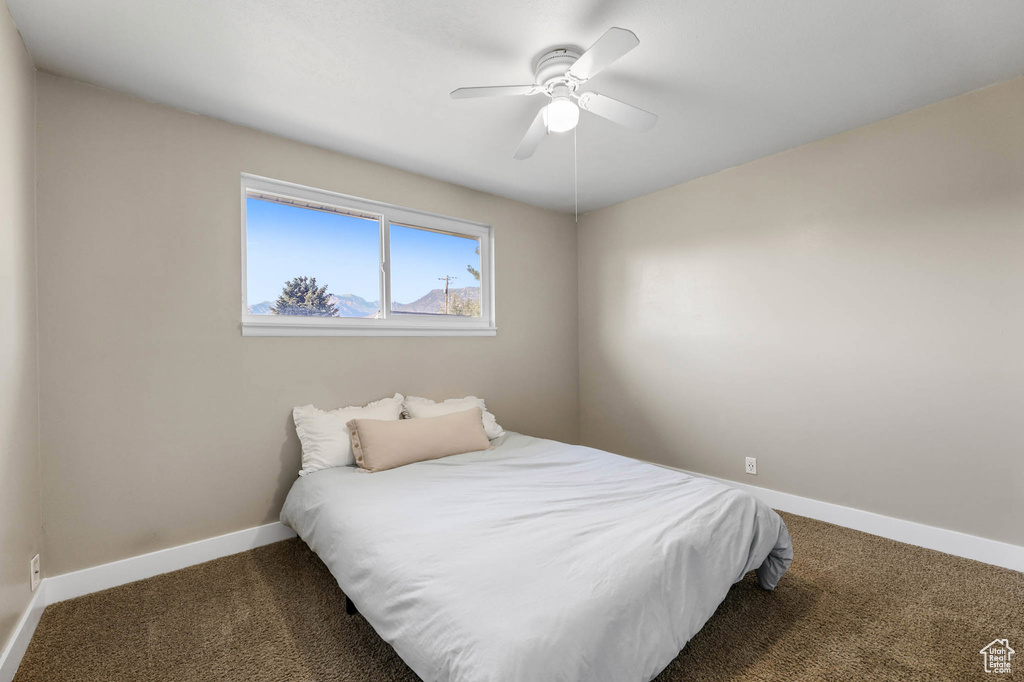 Bedroom with carpet and ceiling fan