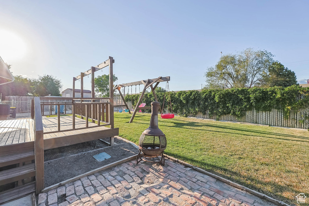 Fenced backyard with a deck