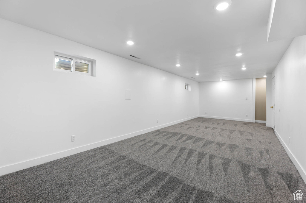 Finished basement with recessed lighting and carpet floors