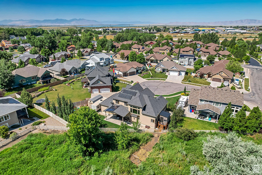 Aerial view of residential area featuring a mountain backdrop