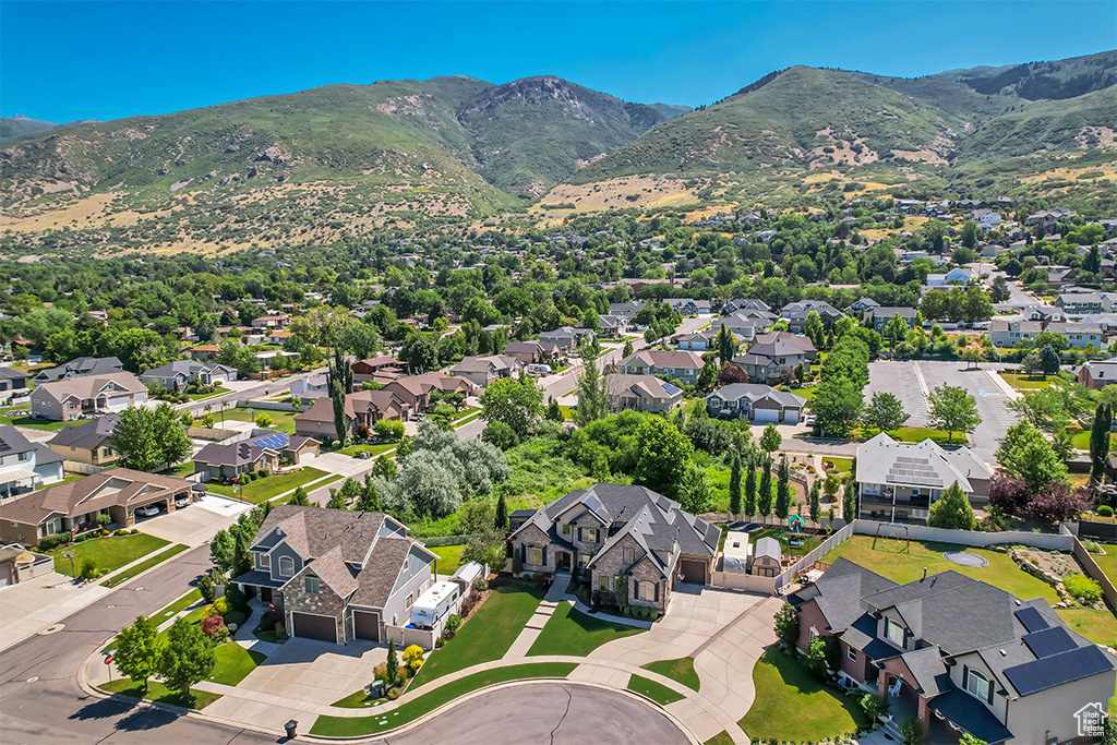 Aerial view of residential area with a mountain backdrop
