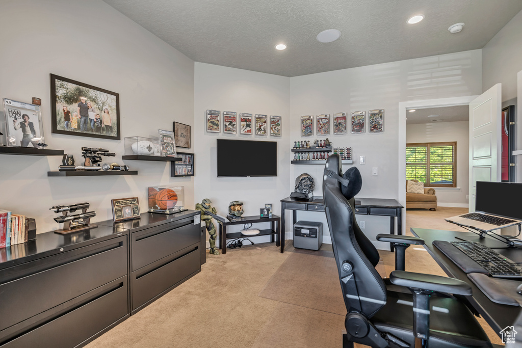 Office area with light carpet and recessed lighting